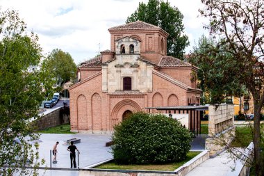 Skaters at the Skate Park next to the historical Santiago del Arrabal church in Salamanca