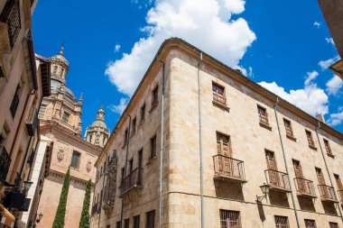 Beautiful architecture of the buildings in the old city of Salamanca including the Dome of La Clerencia seen from the Libreros Street