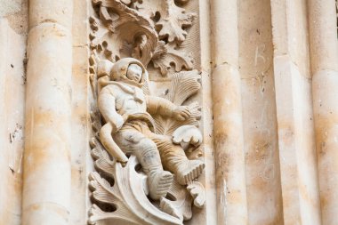 Astronaut carved on the facade of the historical Salmanca Cathedral clipart