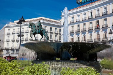 MADRID, SPAIN - MAY, 2018: Fountain and the equestrian statue of Carlos III located at Puerta del Sol in Madrid