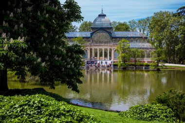 MADRID, SPAIN - MAY, 2018: View of the beautiful Palacio de Cristal a conservatory located in El Retiro Park built in 1887 in Madrid