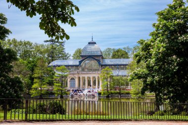 MADRID, SPAIN - MAY, 2018: View of the beautiful Palacio de Cristal a conservatory located in El Retiro Park built in 1887 in Madrid