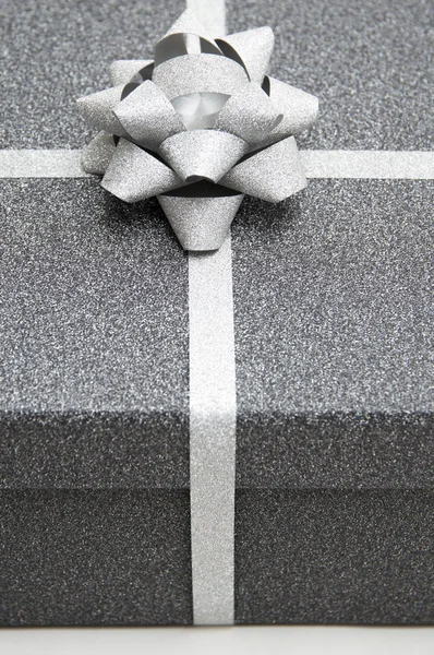black gift box with silver ribbon