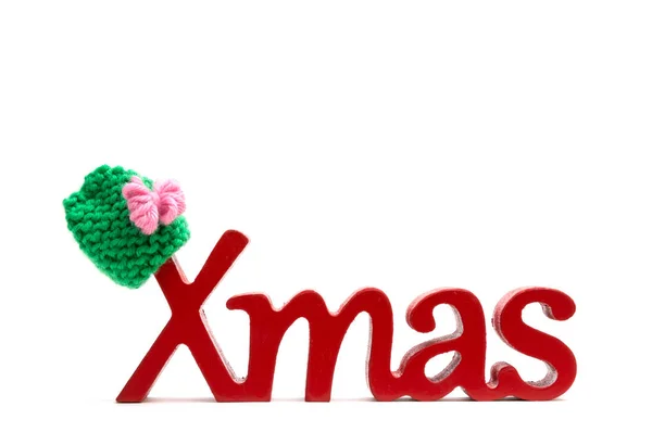 X-mas text and fur hat on white background — Stock Photo, Image