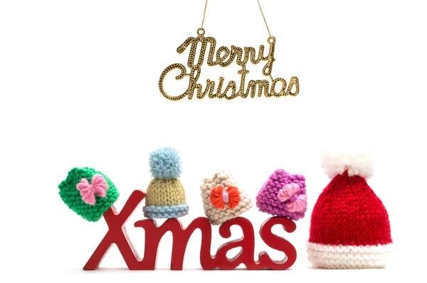 X-mas i Wesołych Świąt Bożego Narodzenia tekst, futro kapelusz na białym tle — Zdjęcie stockowe