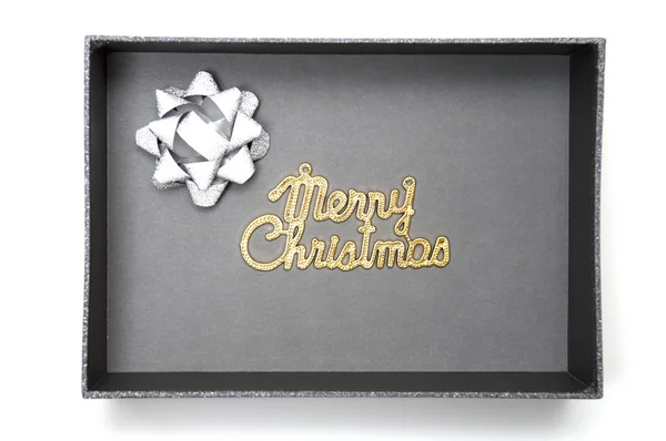 Merry christmas tekst en lint in zwarte geschenkdoos — Stockfoto