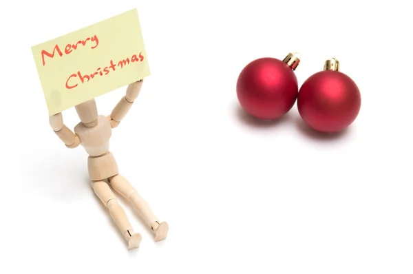 Bonecas conjuntas segurando notas amarelas com Feliz Natal e bola de Natal — Fotografia de Stock