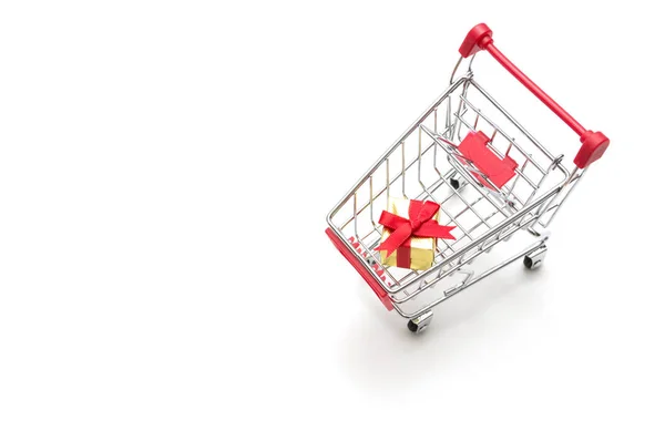 Gift box and shopping cart on white background : economy concept — Stock Photo, Image