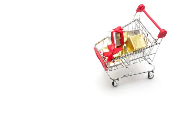 Gift box and shopping cart on white background : economy concept — Stock Photo, Image