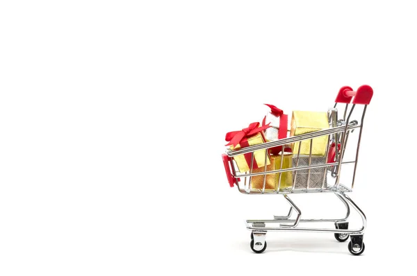 Gift box and shopping cart on white background : economy concept — Stock Photo, Image