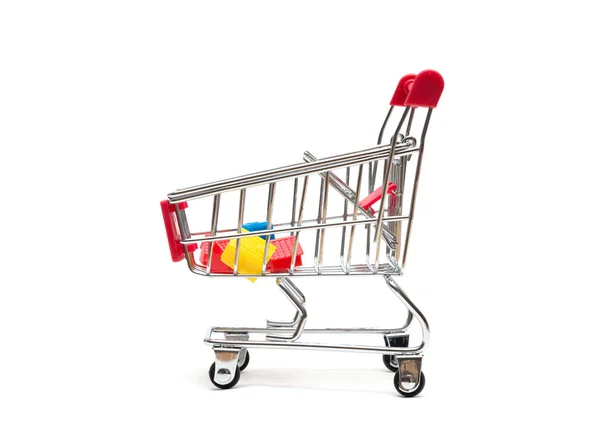 Miniature house and shopping cart on white background : economy — Stock Photo, Image