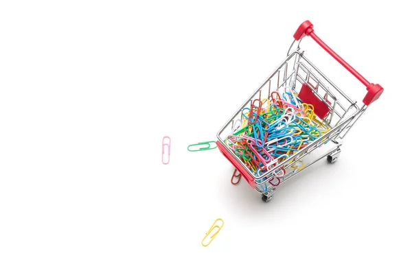 Clip and shopping cart on white background : economy concept — Stock Photo, Image