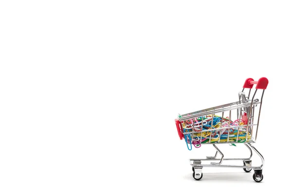 Clip and shopping cart on white background : economy concept — Stock Photo, Image