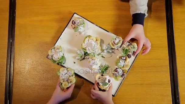 Assorted fruit on wooden board — Stock Video