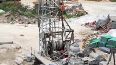 A machine that makes a borehole for water extraction. The car that makes the bore. Creating a water well.