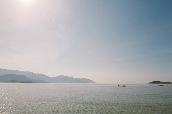Fishing boat at sea on the horizon