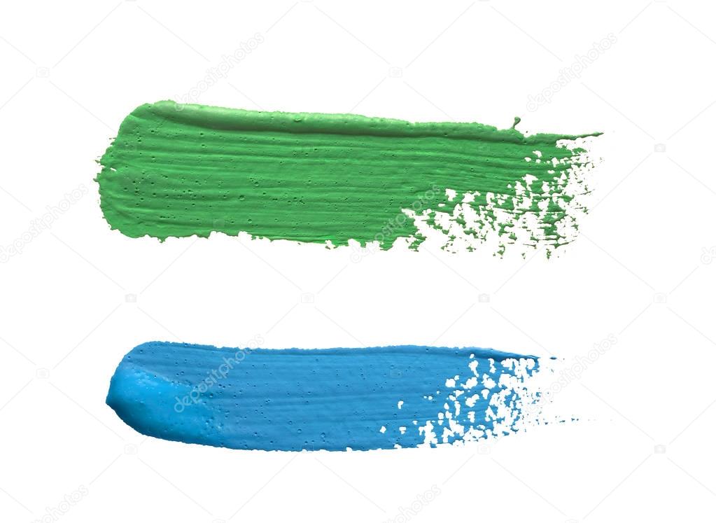 Strokes of blue and green paint isolated on white background