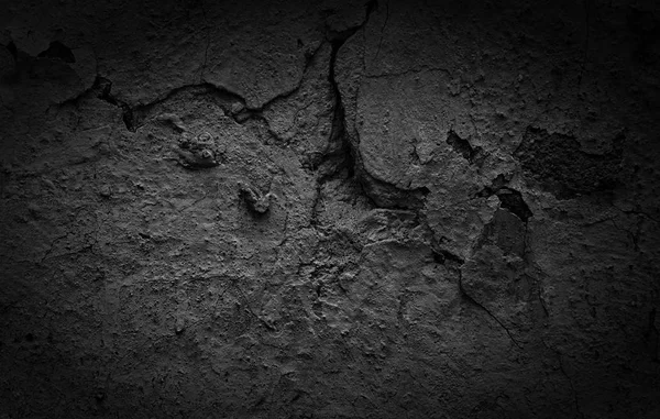 Black Cracked concrete texture closeup background