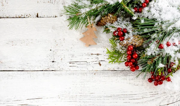 Christmas decoration on white old wooden board — Stock Photo, Image