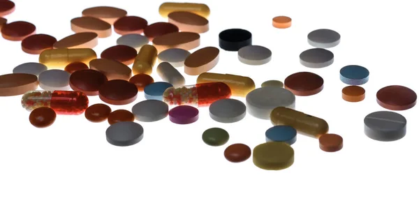 Wiele kolorowych tabletek i kapsułek — Zdjęcie stockowe