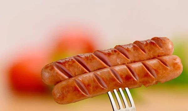 Grilled sausage on a fork — Stock Photo, Image