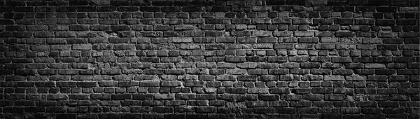Old black brick wall background. — Stock Photo, Image