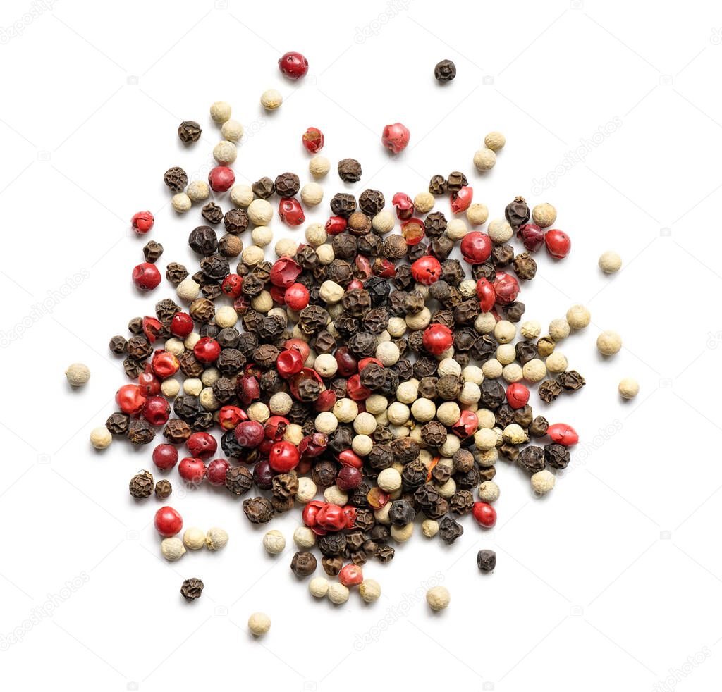 Heap of various pepper peppercorns isolated on white. Top view
