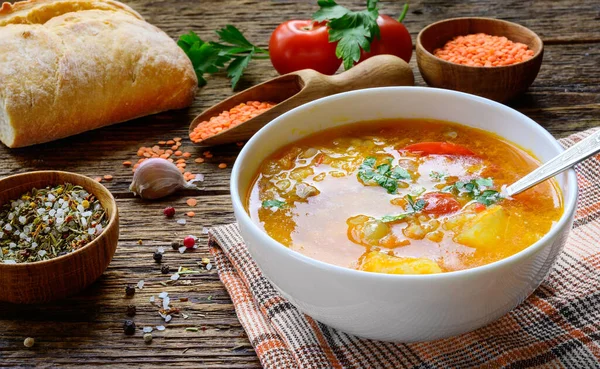 Red lentil soup on the rustic wooden table. — Stock Image Red lentil soup on the rustic wooden table. Stock Image