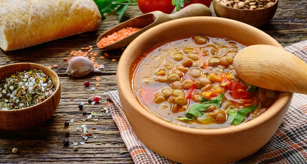 Lentil soup in wooden bowl. — Stock Image Lentil soup in wooden bowl. Royalty Free Stock Photos