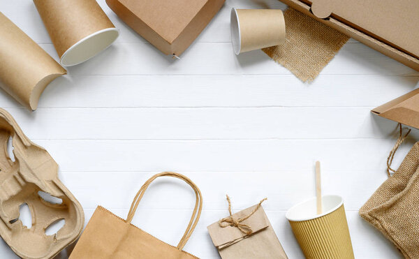 Food paper packaging from environmentally friendly materials on white table