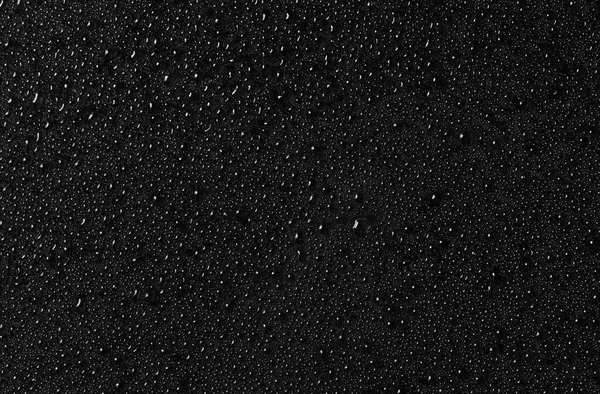 Water drops on black glass surface. Texture. Top view — 스톡 사진