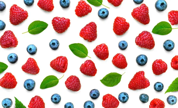 Fruit pattern of wild berries. Raspberries and blueberries with green leaves isolated on white background. Flat lay — Φωτογραφία Αρχείου