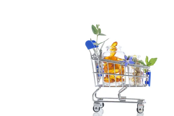 Blauwe Shopping trolley met pillen en medicijnen — Stockfoto