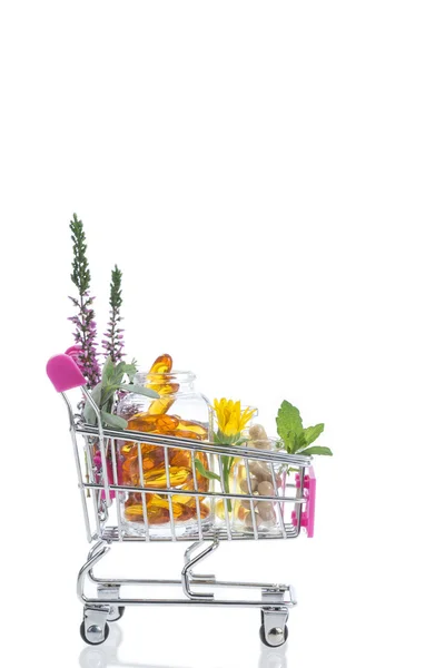 Roze Shopping trolley met pillen en medicijnen — Stockfoto