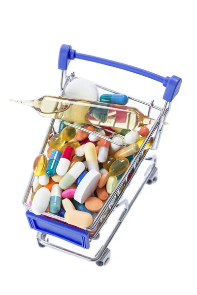 Isolated shopping cart full of medicine with pills and capsules — Stock Photo, Image