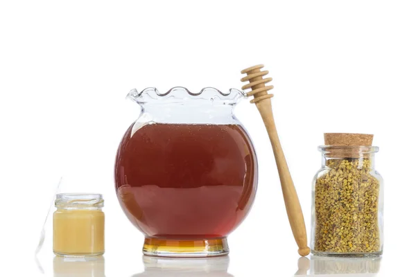 Arı arı sütü polen küçük cam kavanoz bal ile ve bir mutfak — Stok fotoğraf