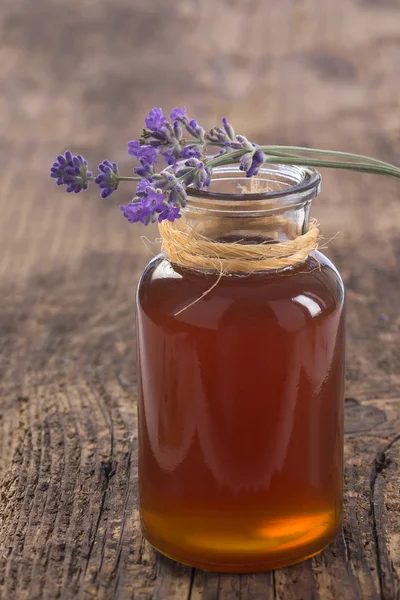 herbal honey in jar with fresh flower