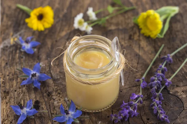 Raw organic royal jelly in a small bottle — Stock Photo, Image