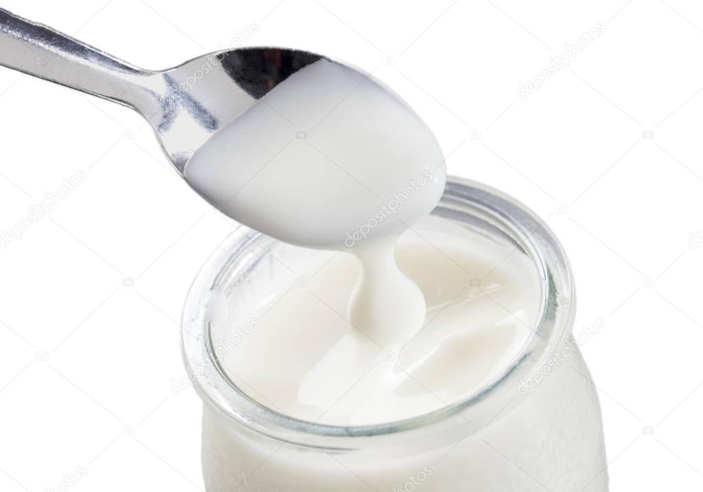 yogurt with spoon isolated on white background