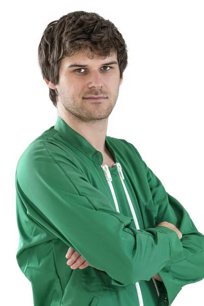 Worker wearing green working coat crossed arms on white — Stock Photo, Image