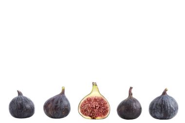 Food frame made of ailgned figs on white background, with one alf cut in the midle clipart