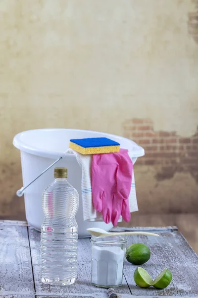 View of baking soda with ,white, bucket, mop, gloves, lemon, vinegar, glove, , natural mix,for effective house cleaning,on wooden floor green cleaning concept — Stock Photo, Image