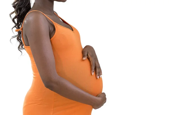 Zwangere vrouw strelen van haar buik op een witte achtergrond — Stockfoto