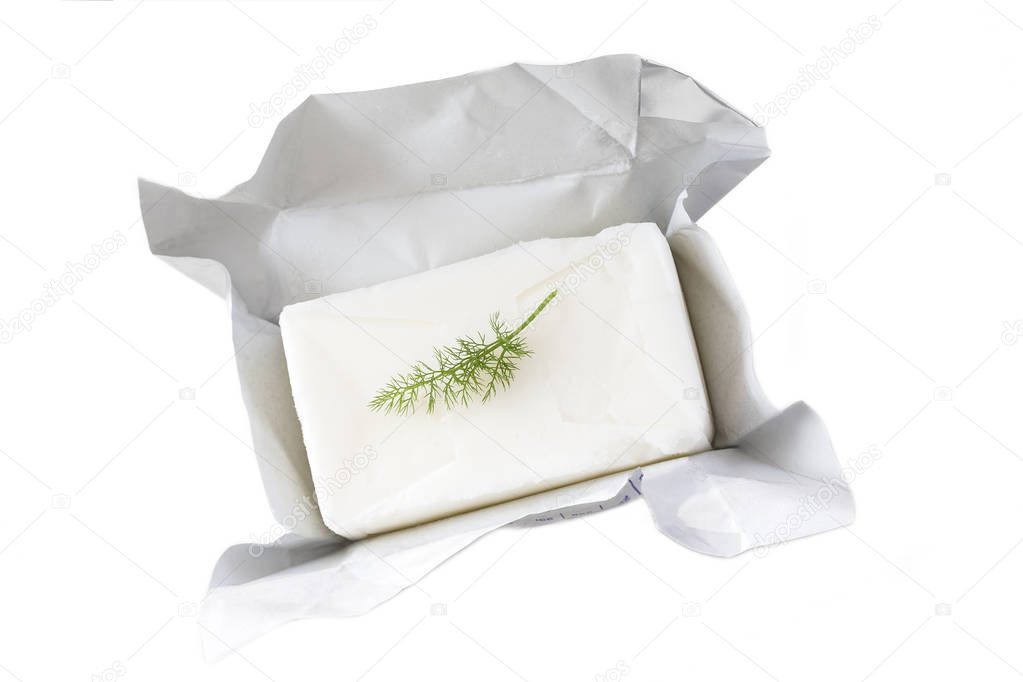 block of pork lard unwrapped , open with parsley on white background
