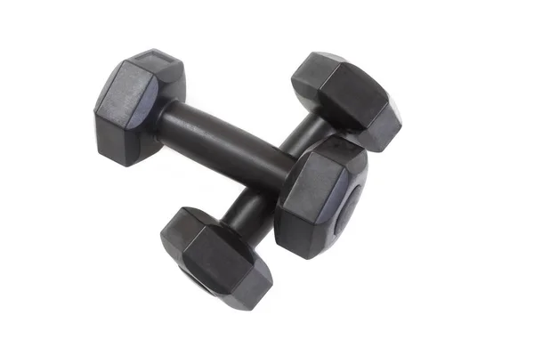 Twee zwart plastic bekleed dumbells geïsoleerd op witte achtergrond. — Stockfoto