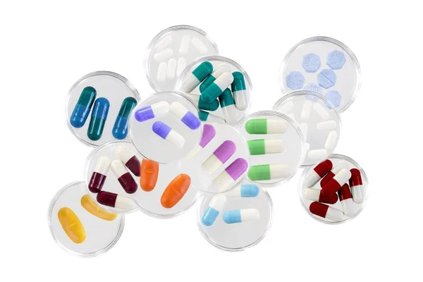 Healthcare and mmedical concept: addiction,stack of Medicine Tablets in glass petri dish on white background — Stock Photo, Image