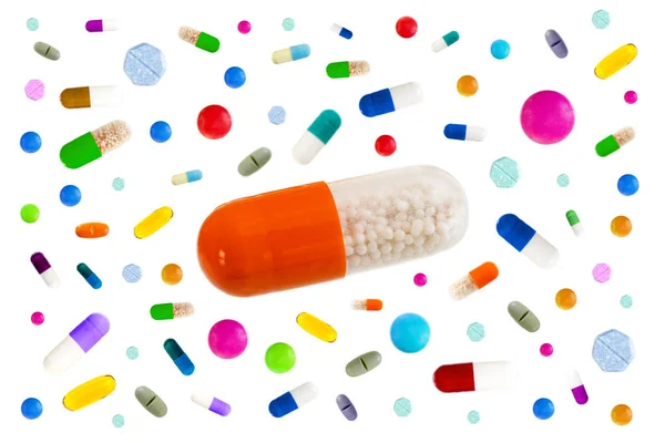 Symbol image of drugs danger : Many colorful medicines Pills and capsules with in the middle a big one on white background — Stock Photo, Image