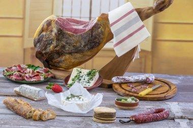 Jamon. Jamon serrano. Traditional Spanish ham close up. Dry cured spanish pork ham in a plate.old vintage wooden background clipart