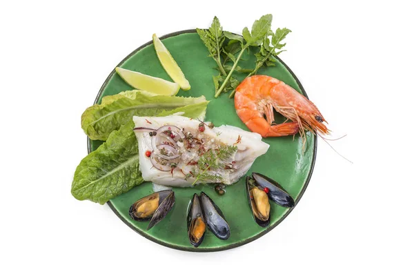 Cod fish fillet, Atlantic cod with seafood mussells,shrimps,lime and vegetable, green plate on white — Stock Photo, Image