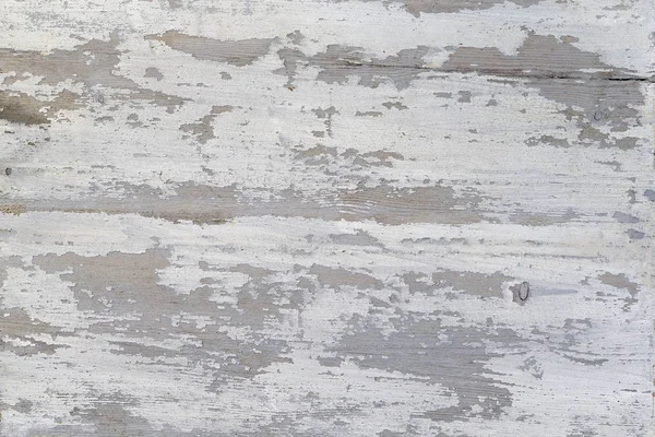A Weathered wood texture with peeling white paint. Abstract grunge background. — Stock Photo, Image